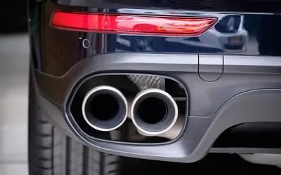 Car exhaust system photographed from below